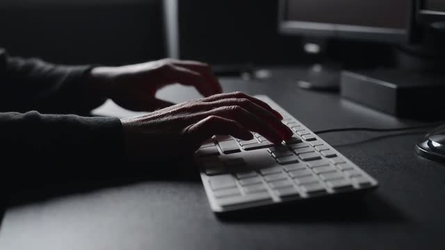 Hacker Typing on Keyboard Cyber Security Risk